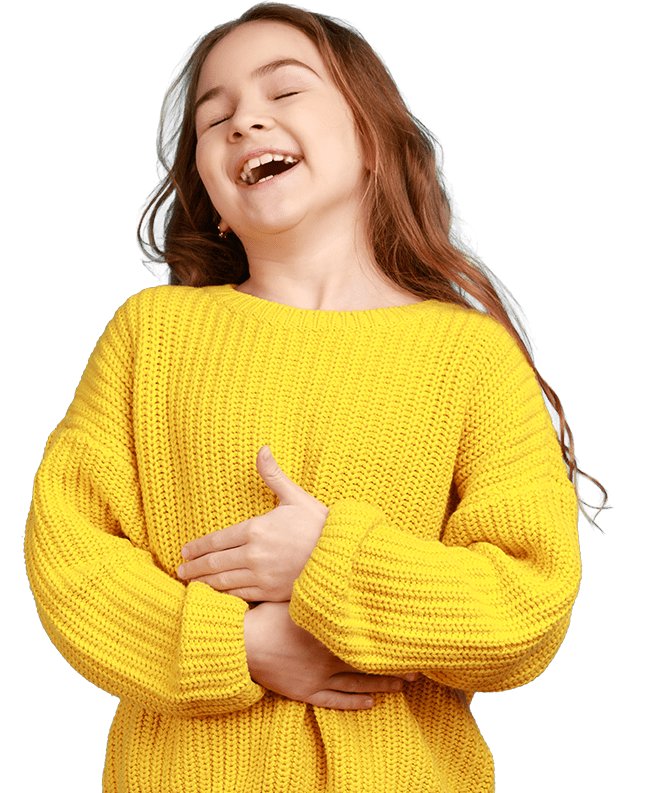 Happy positive little girl laughing out loud, holding her belly, hearing funny joke, wearing yellow casual style sweater