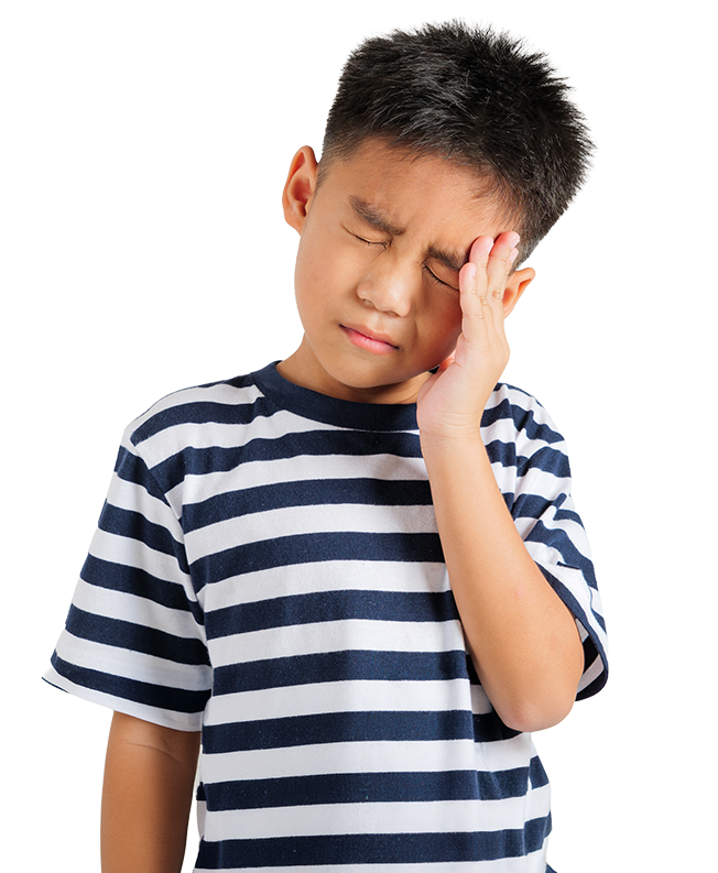 Young boy in striped shirt, eyes closed, holding his head with a pained expression, suggesting a headache. Black background emphasizes his discomfort.